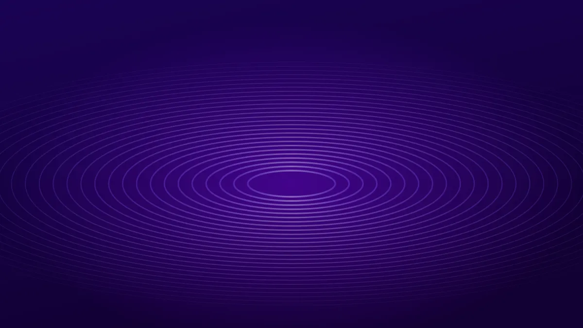 Concentric violet ripples spreading across a dark surface.